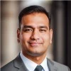 Professional portrait used in an archived profile card